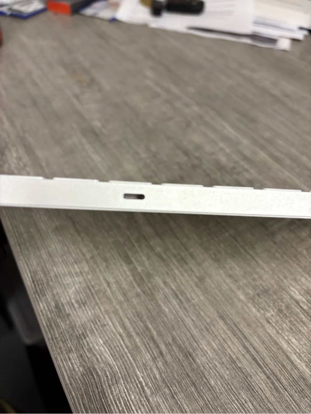 Apple Magic Keyboard in Silver and White lightning cable